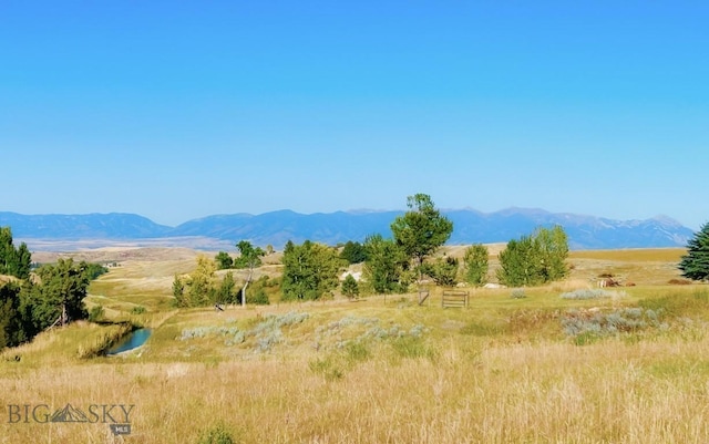 view of mountain backdrop featuring rural landscape