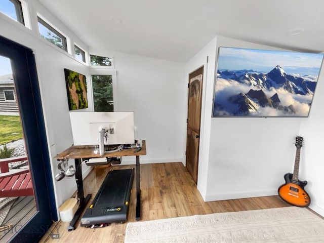home office featuring wood finished floors and baseboards