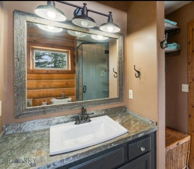 bathroom with vanity and rustic walls