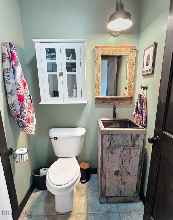 13013 Little Holland Rd, Manhattan, MT 59741 - bathroom with vanity and tile patterned flooring