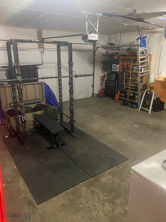 303 Treasure, Bozeman, MT 59718 - garage featuring a garage door opener