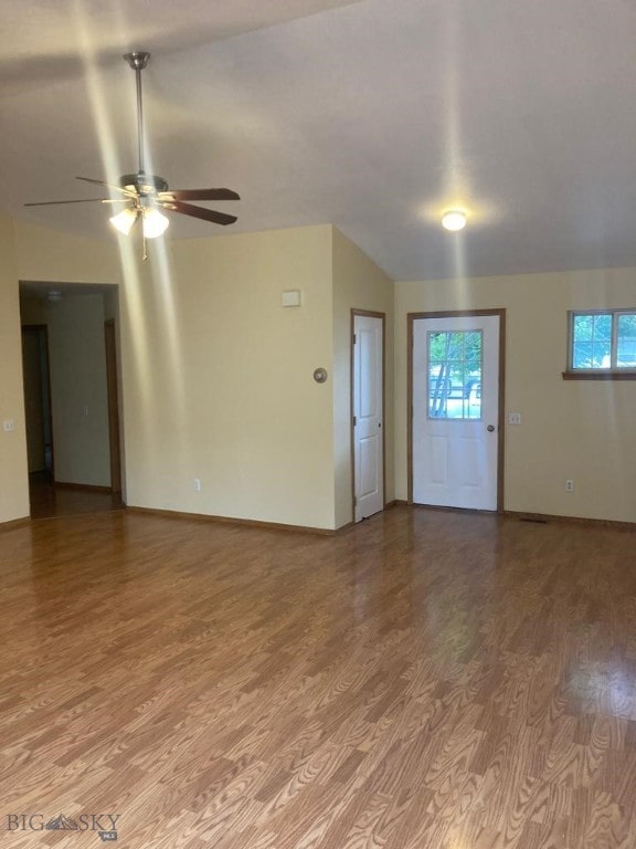 303 Treasure, Bozeman, MT 59718 - unfurnished living room with a ceiling fan, light wood-style floors, and plenty of natural light