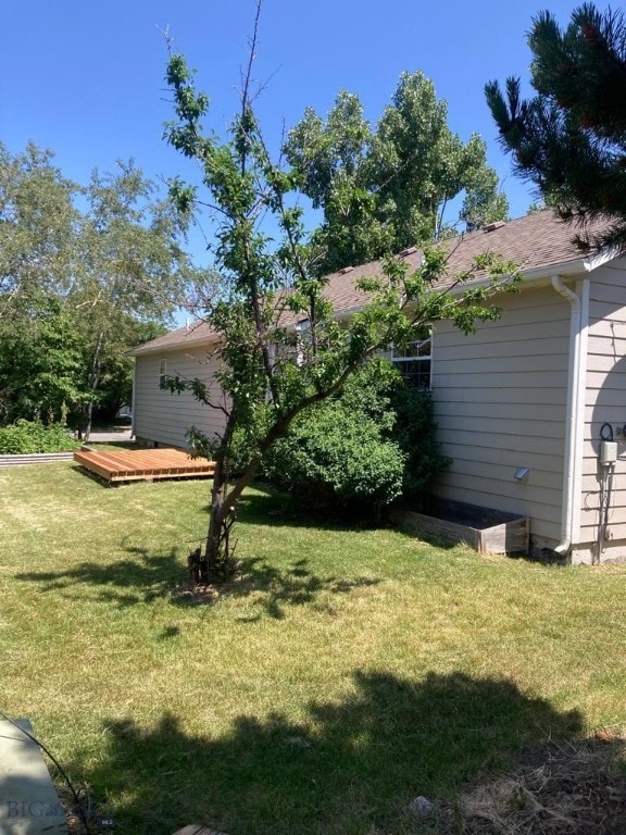303 Treasure, Bozeman, MT 59718 - view of green lawn with a deck