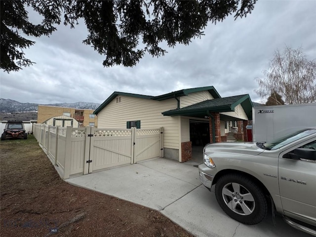105 Country Club Ln, Butte, MT 59701 - view of property exterior featuring a gate, fence, and a mountain view