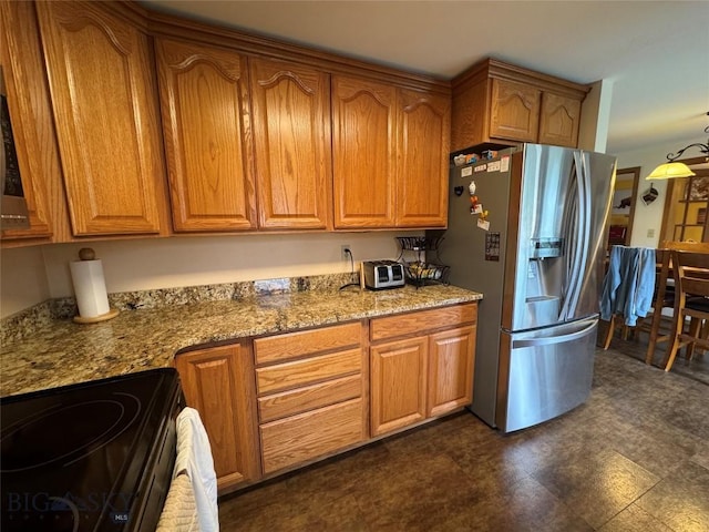 105 Country Club Ln, Butte, MT 59701 - kitchen featuring stainless steel refrigerator with ice dispenser, black range with electric stovetop, brown cabinets, and stone counters