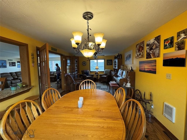 105 Country Club Ln, Butte, MT 59701 - dining area with a chandelier and wood finished floors