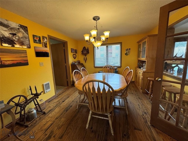 105 Country Club Ln, Butte, MT 59701 - dining room with dark wood-type flooring, plenty of natural light, a chandelier, and a textured ceiling
