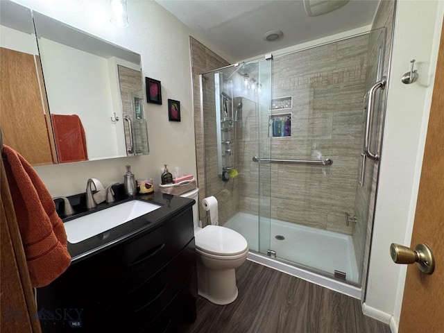 105 Country Club Ln, Butte, MT 59701 - full bathroom featuring wood finished floors, toilet, a shower stall, and vanity