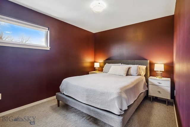 carpeted bedroom featuring baseboards
