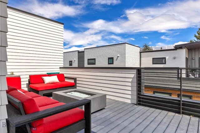 wooden deck with an outdoor hangout area