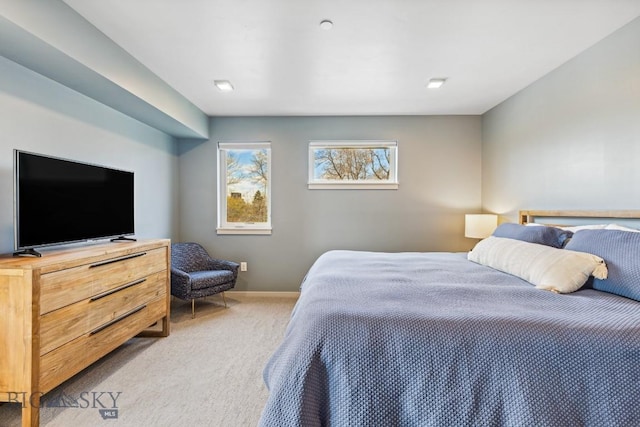 bedroom with carpet and baseboards