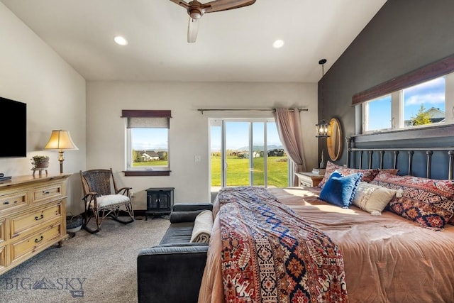 bedroom with access to exterior, carpet flooring, multiple windows, vaulted ceiling, and a ceiling fan