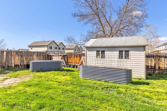 view of yard with an outbuilding and a storage shed