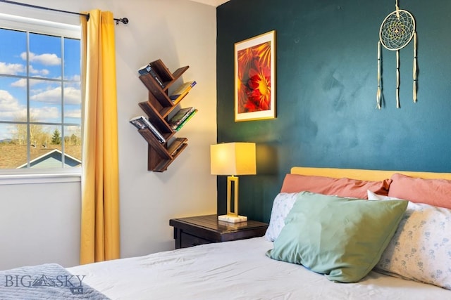 bedroom with multiple windows