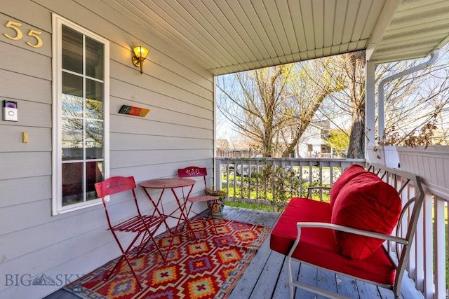 wooden terrace with a porch