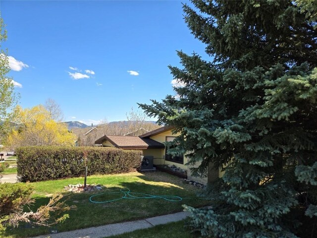 1104 N Spruce Dr, Bozeman, MT 59715 - view of grassy yard featuring a mountain view
