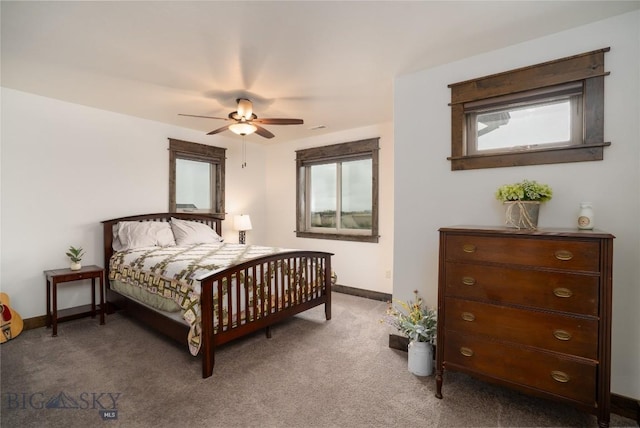 bedroom with carpet, baseboards, and a ceiling fan