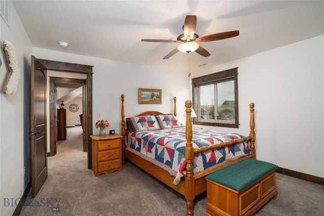 bedroom with carpet floors, a ceiling fan, and baseboards