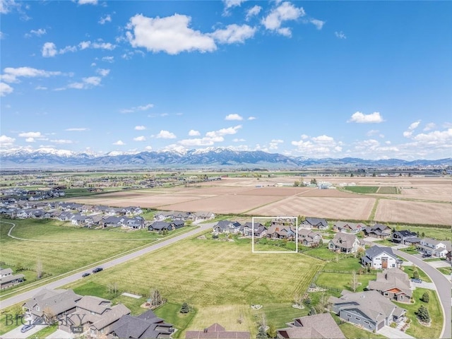 aerial view of residential area featuring mountains