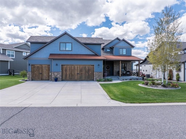 view of front facade with a front yard, concrete driveway, covered porch, stone siding, and an attached garage
