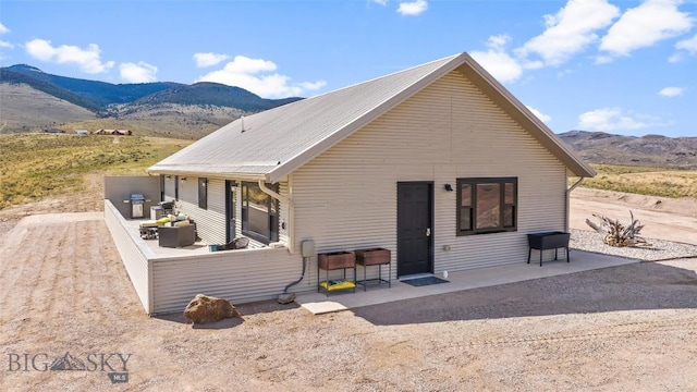 2200 Sugarloaf Mountain Rd, Glen, MT 59732 - view of front of property featuring a mountain view and a patio