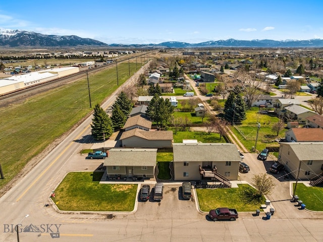 500/502 Idaho St, Belgrade, MT 59714 - aerial perspective of suburban area featuring mountains