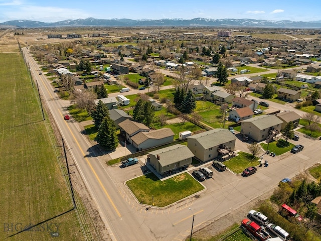 500/502 Idaho St, Belgrade, MT 59714 - aerial perspective of suburban area with a mountain backdrop
