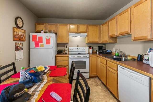500/502 Idaho St, Belgrade, MT 59714 - kitchen with white appliances, a sink, and under cabinet range hood