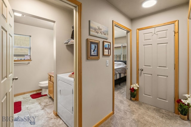 500/502 Idaho St, Belgrade, MT 59714 - bathroom with washer / dryer, toilet, and baseboards
