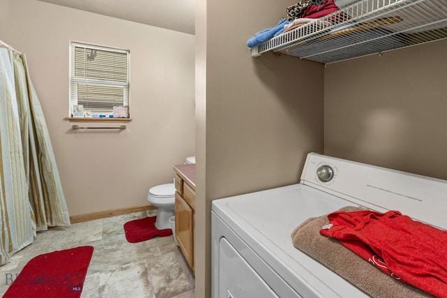 500/502 Idaho St, Belgrade, MT 59714 - laundry room featuring washer / dryer and baseboards