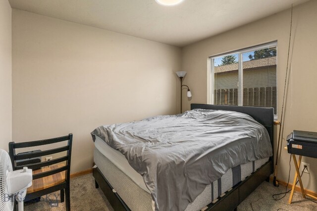 500/502 Idaho St, Belgrade, MT 59714 - carpeted bedroom with baseboards