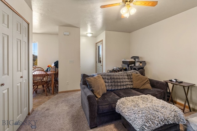 500/502 Idaho St, Belgrade, MT 59714 - carpeted living area featuring ceiling fan and baseboards