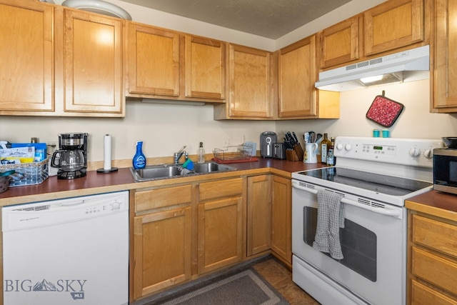 500/502 Idaho St, Belgrade, MT 59714 - kitchen featuring white appliances, under cabinet range hood, and a sink