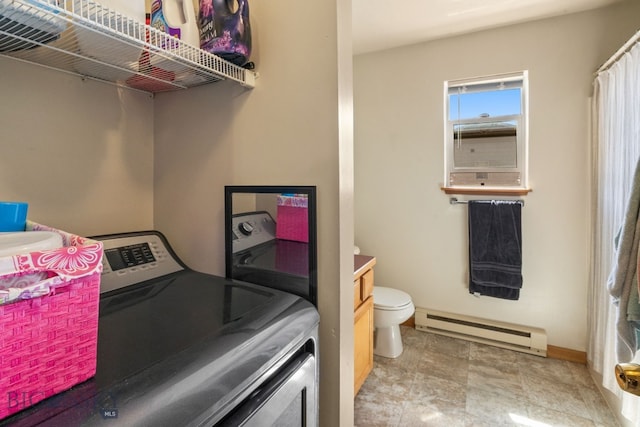 500/502 Idaho St, Belgrade, MT 59714 - washroom with a baseboard heating unit and baseboards