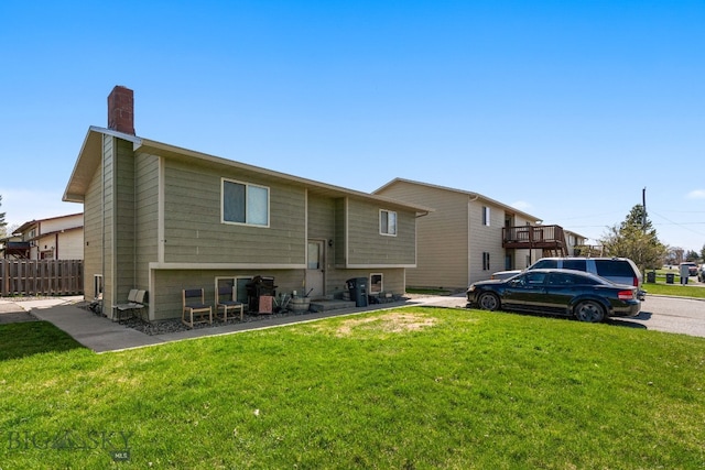 500/502 Idaho St, Belgrade, MT 59714 - rear view of house featuring a chimney