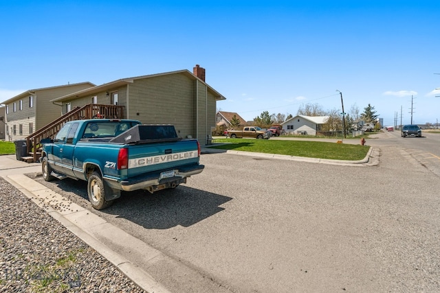 500/502 Idaho St, Belgrade, MT 59714 - view of property exterior featuring a chimney and a residential view