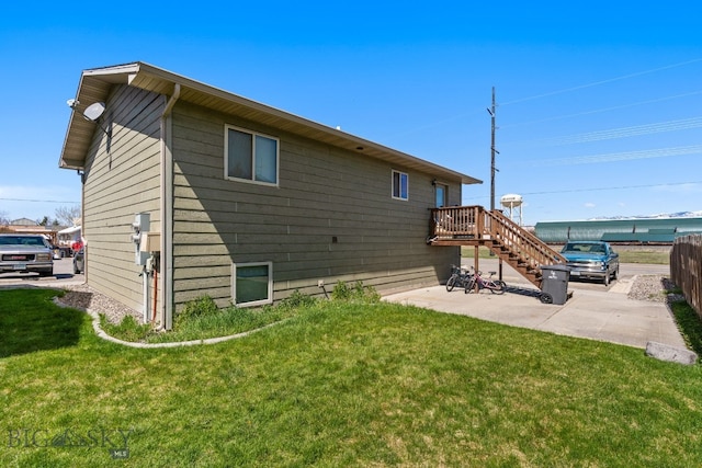500/502 Idaho St, Belgrade, MT 59714 - rear view of house featuring a yard, a patio, and stairway