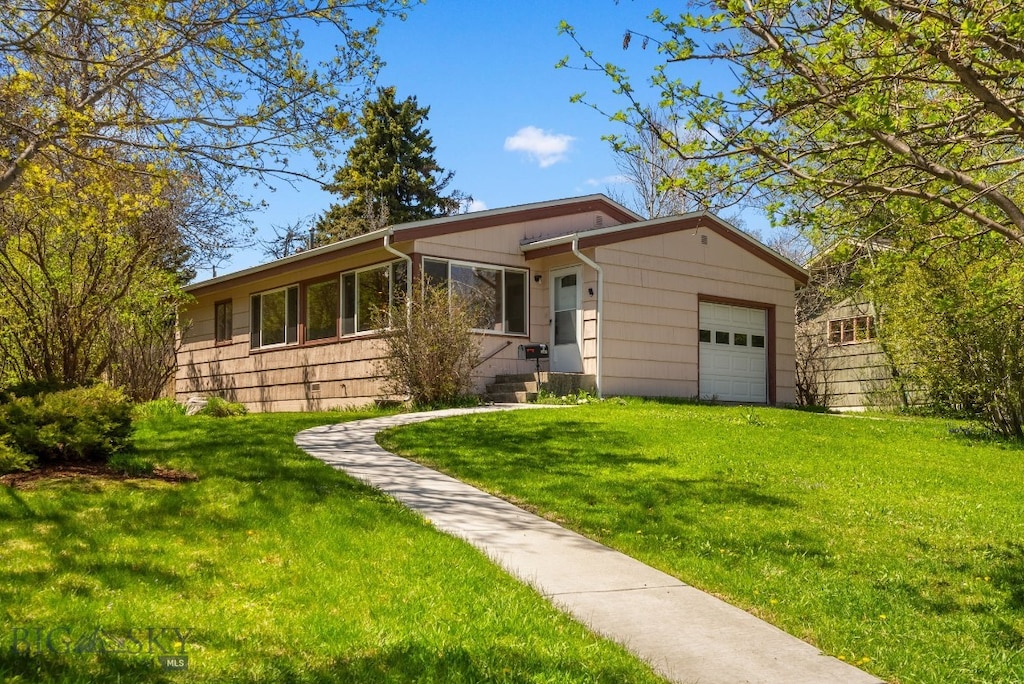1017 S Tracy Ave, Bozeman, MT 59715 - single story home with a garage and a front lawn