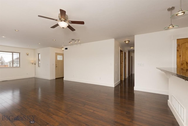 unfurnished living room featuring a ceiling fan, dark wood-style flooring, baseboards, and recessed lighting