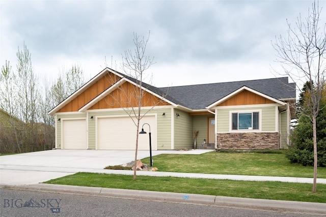 craftsman-style home featuring a garage, driveway, board and batten siding, a front yard, and roof with shingles
