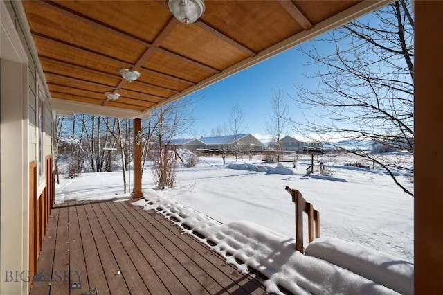 view of snow covered deck