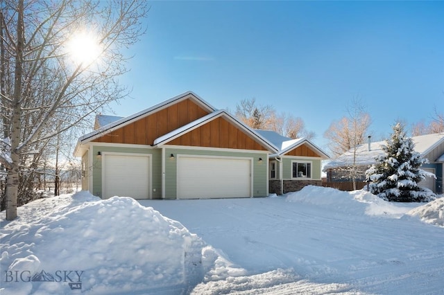 view of front of home featuring board and batten siding and an attached garage