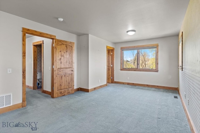 3450 W Hollyhock Dr, Belgrade, MT 59714 - unfurnished bedroom featuring baseboards and carpet