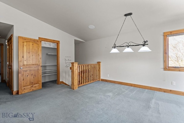 3450 W Hollyhock Dr, Belgrade, MT 59714 - carpeted empty room featuring vaulted ceiling and baseboards