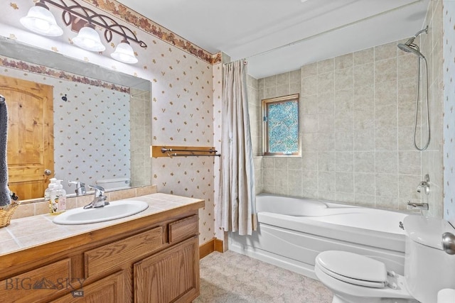3450 W Hollyhock Dr, Belgrade, MT 59714 - full bath featuring shower / bath combination with curtain, toilet, wallpapered walls, vanity, and baseboards