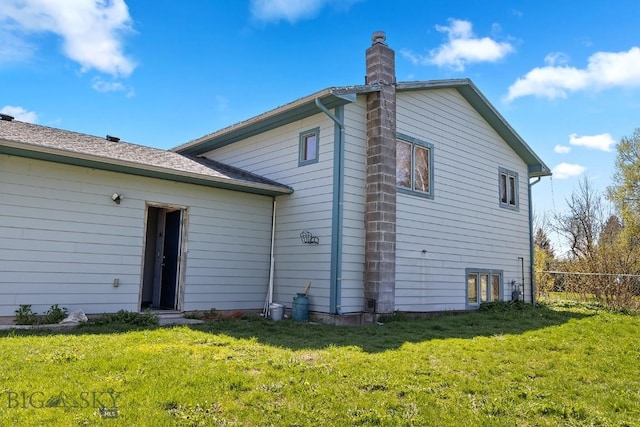 3450 W Hollyhock Dr, Belgrade, MT 59714 - back of house featuring a chimney