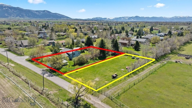 3450 W Hollyhock Dr, Belgrade, MT 59714 - aerial overview of property's location featuring a mountainous background and property parcel outlined