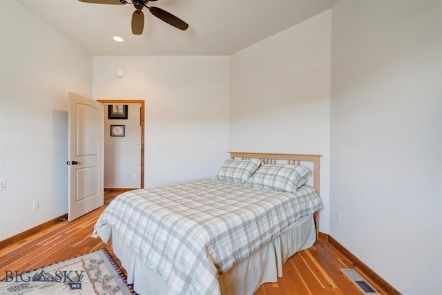 bedroom with light wood-style flooring, baseboards, ceiling fan, and recessed lighting
