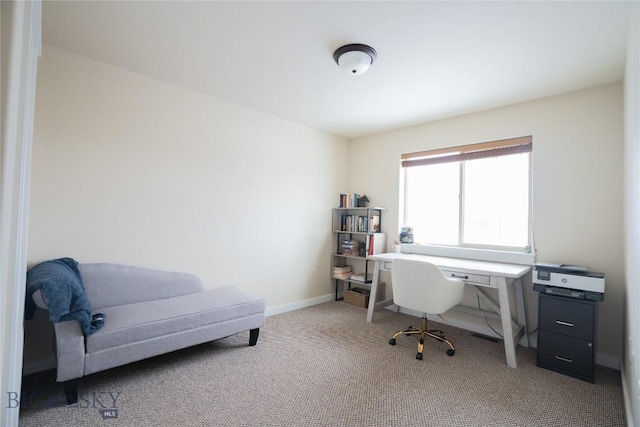 carpeted office with baseboards