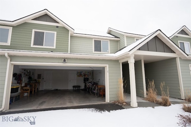 view of front facade featuring an attached garage and board and batten siding